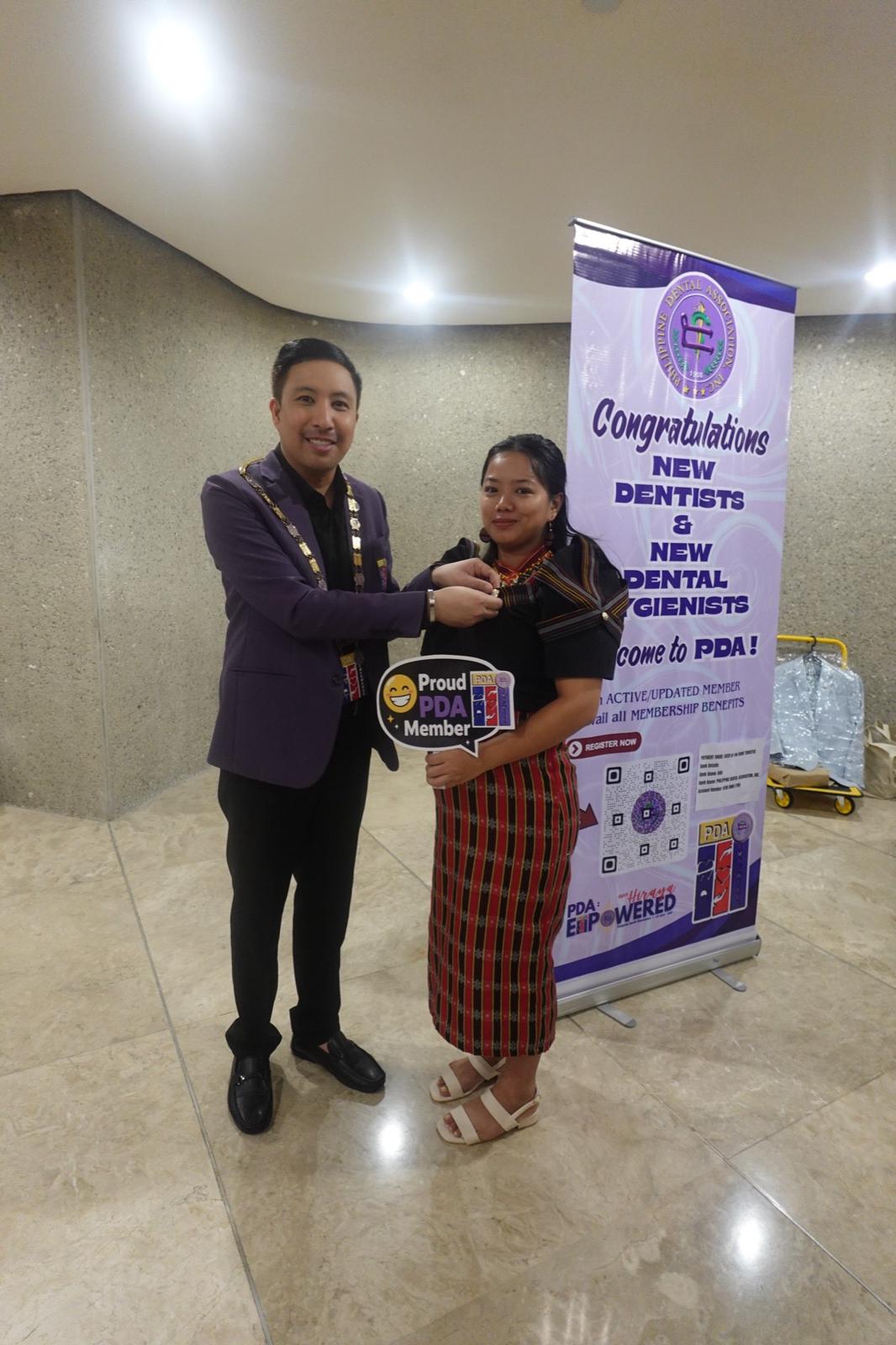 New PDA member being welcomed at the induction photo booth