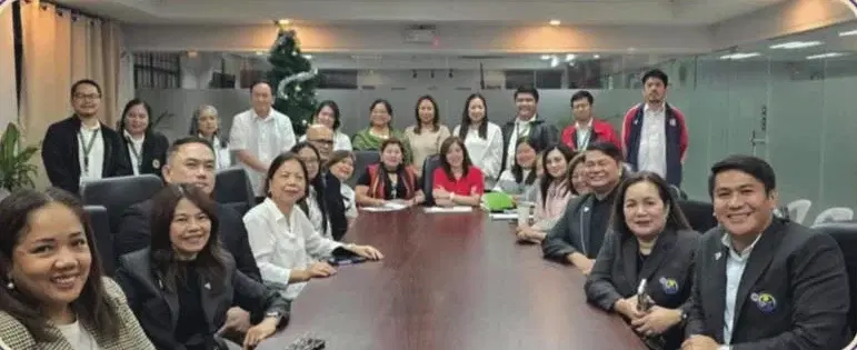 PDA leaders and staff gathered around a conference table